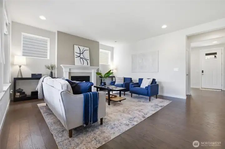 Another view of the spacious great room where the fireplace creates a warm gathering place year-round.
