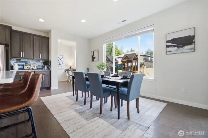 Sunlight pours through the dining room, creating the perfect setting for everyday meals and holiday celebrations.
