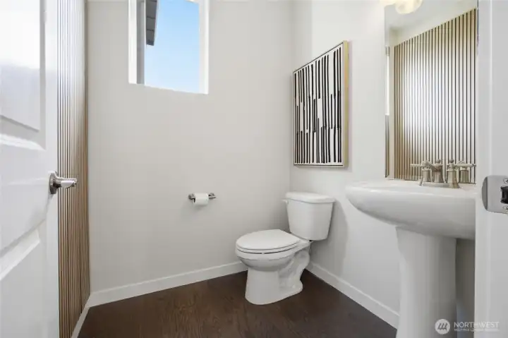 Convenient main-floor powder room for family and guests.