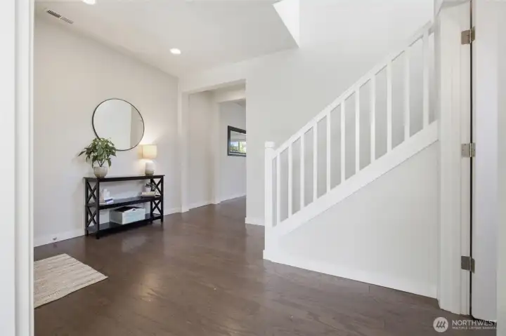 Bright, open spaces create an inviting first impression throughout the home.