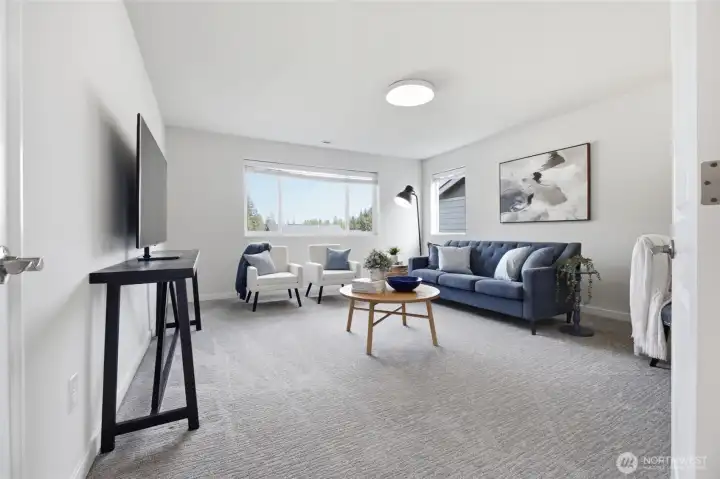 Upstairs, a versatile loft creates the perfect second living room, media space, or playroom.