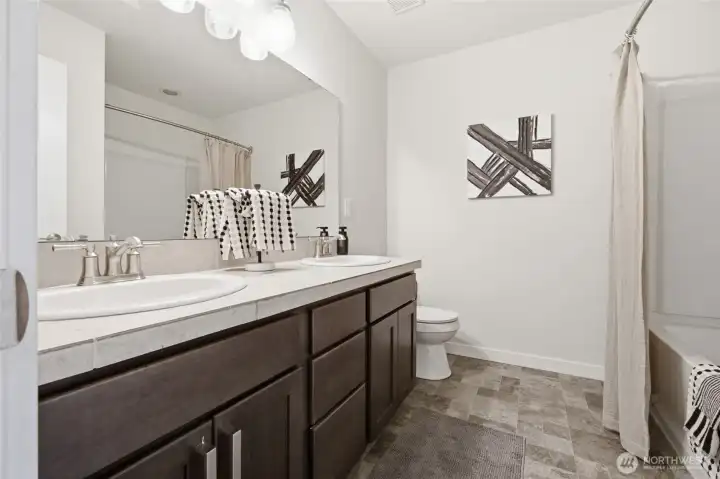 A well-appointed hall bath serves the secondary bedrooms beautifully.