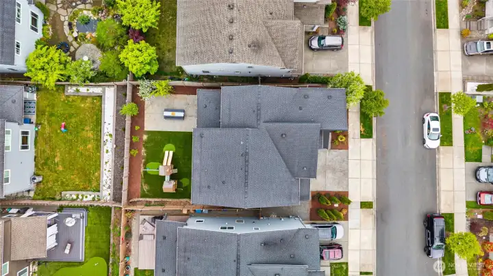 An aerial perspective showcases the home's generous lot and finished outdoor spaces.