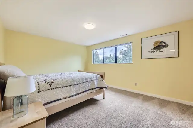 Upper level primary bedroom with attached 3/4 bath