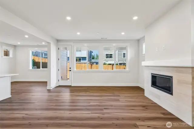 Welcoming great room warmed by a gas fireplace.