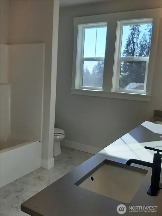 Large secondary bath features dual vanity