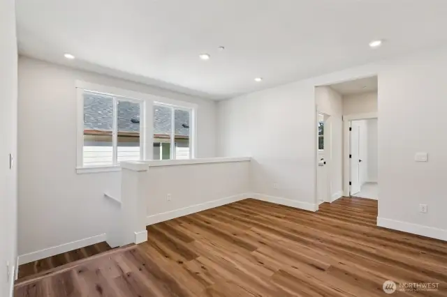 Loft are looking towards the hall bath and entry to 3rd and 4th bedrooms.