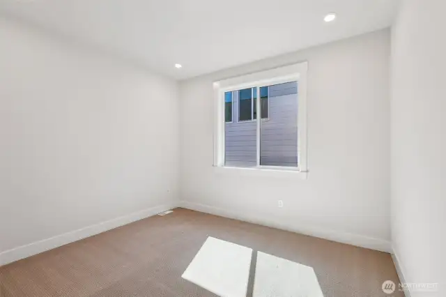 Bright and sunny 3rd bedroom.