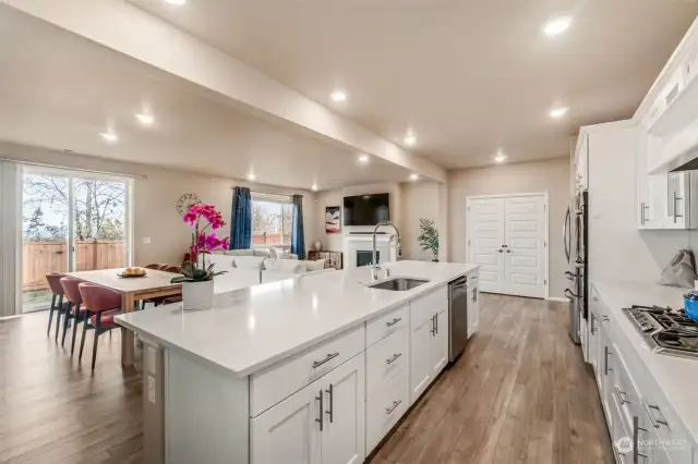 Engineered hardwood flooring provides a stunning canvas for this beautiful open concept main level.