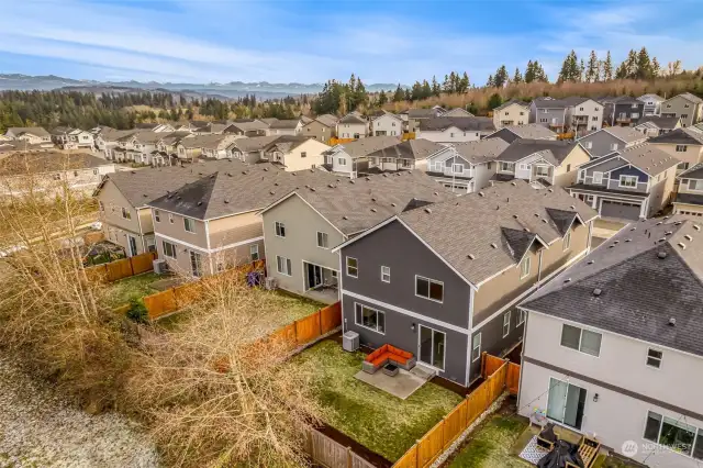 Home backs up to a wooded buffer space to maximize privacy.