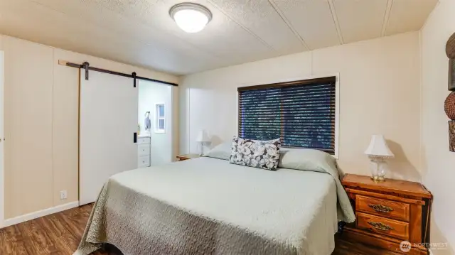 Primary bedroom with adjoining bathroom. Walk-in closet not shown.