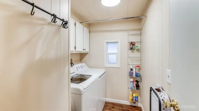 Laundry area with cabinets