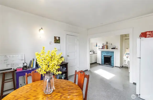 Dining to kitchen w/charming fireplace