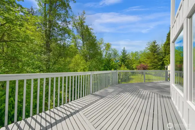Enjoy the serenity of Dakot Creek from the expansive main floor deck.