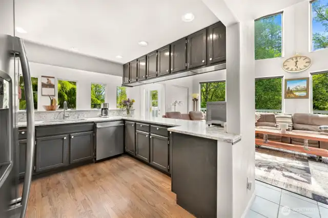 Kitchen opens to dining and living rooms