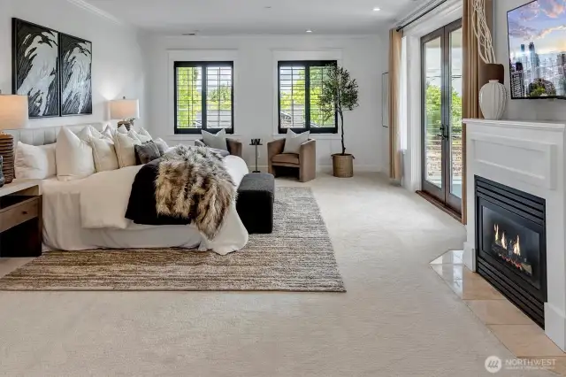 Owner's retreat with a spa-inspired bath, spacious walk-in closet and a cozy gas fireplace for added ambiance. Enjoy sunsets from the serene view deck.