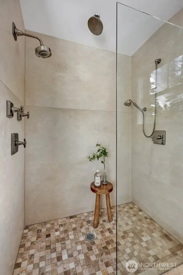 The ultimate shower retreat, featuring a luxurious triple-head system w/soothing rain shower, targeted sprayer, and a full-pressure showerhead - designed for a customized spa-like experience!