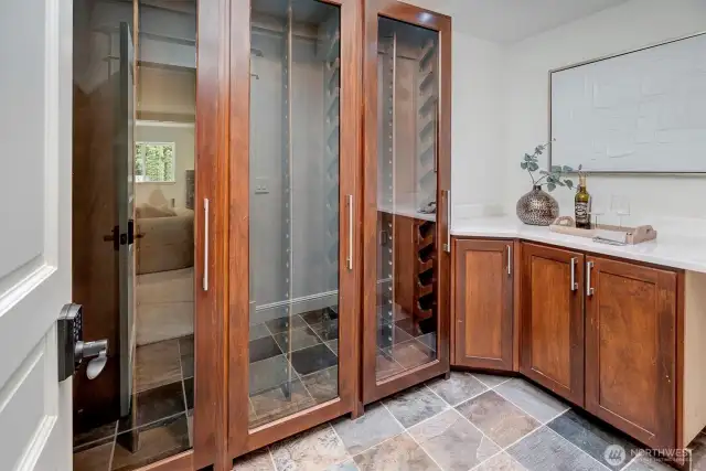 Private and secure bespoke wine cellar holds a minimum 100 bottles plus counter display space!