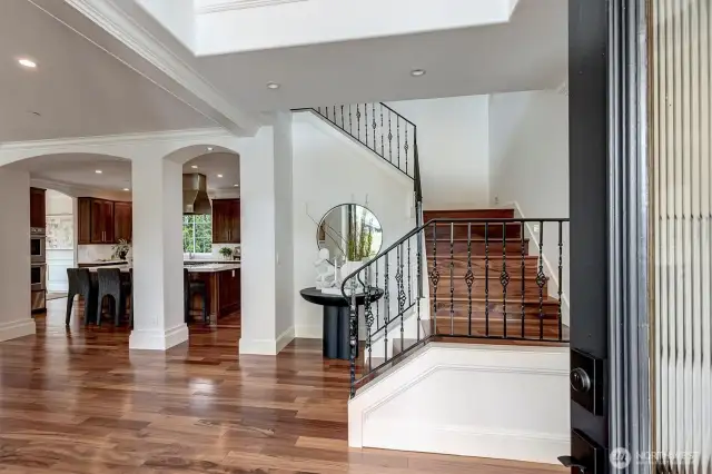 2-story entry with beautiful matte black chandelier and elegant staircase!