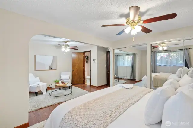 Primary suite with bonus sitting area and 1/2 bath.