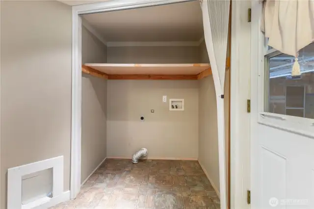 Downstairs utility room with cat door.
