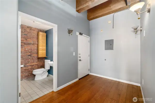 Entry with bathroom and stacking washer dryer.