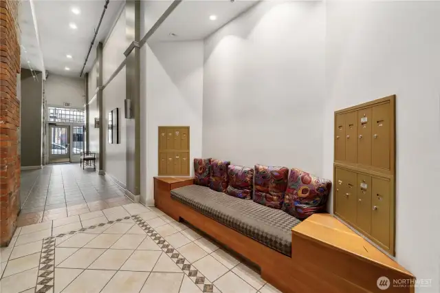 Main floor foyer. Resident mailboxes, and comfortable seating.