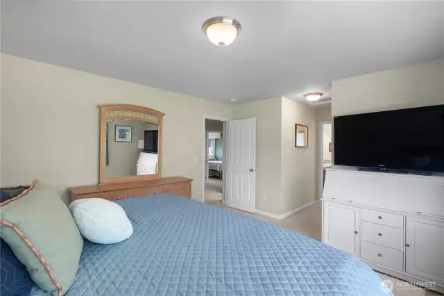 Another view of Primary Bedroom and short hallway to closet and primary bath.