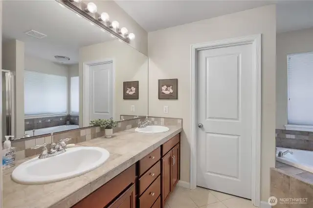 Double sinks in Primary Bath, with door to water closet.