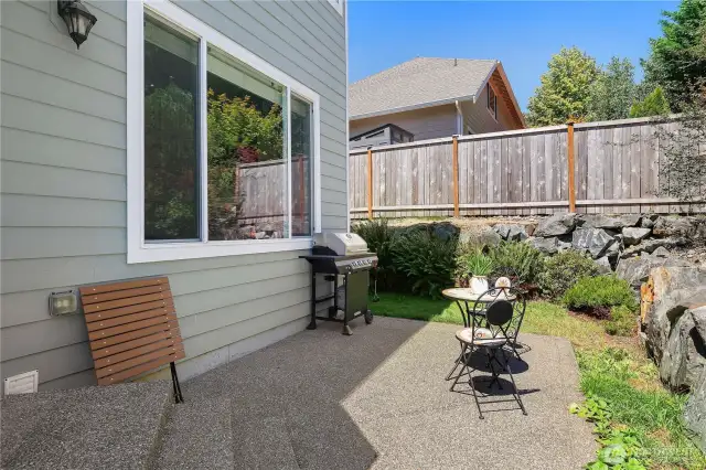 Back patio with privacy fencing between neighbors.