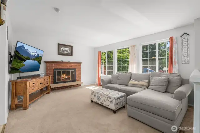 Living room with fireplace and picture windows