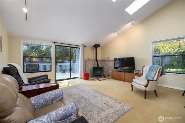Propane fired free standing stove/fireplace with sliding glass door leading you onto the deck