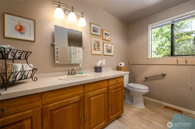 Guest bathroom with tub and shower