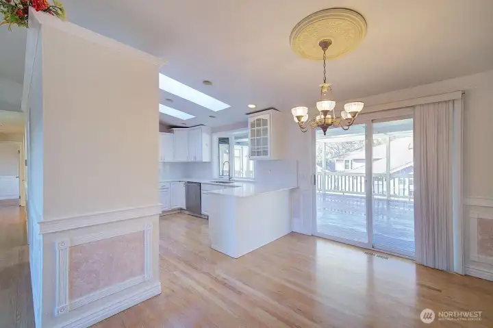 Dining room with sliders to covered deck.
