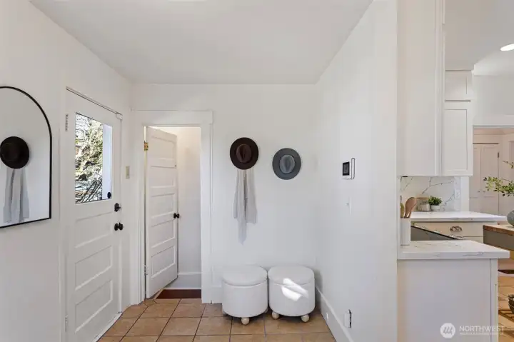 Mud room area and door to back deck and yard.