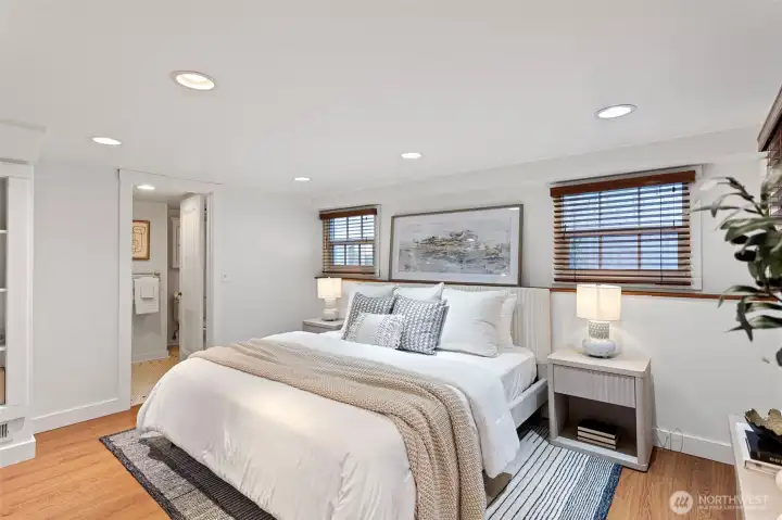 Lower level primary suite with ¾ bathroom and separate entry to backyard area.