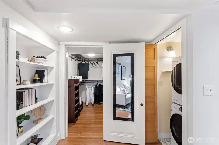 Built-in storage shelves and a laundry room complete the primary suite.