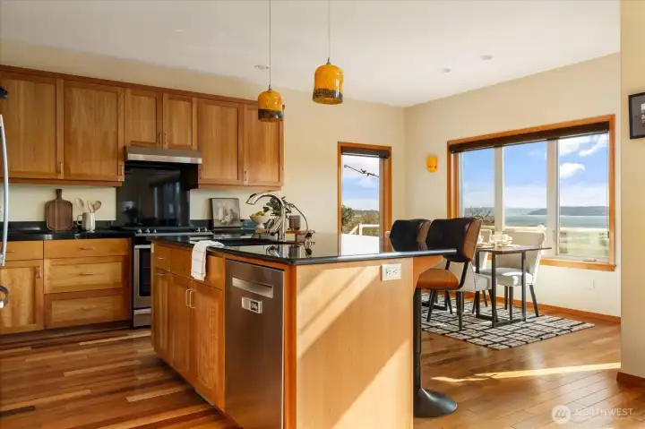 Black granite counters compliment the custom alder cabinets.