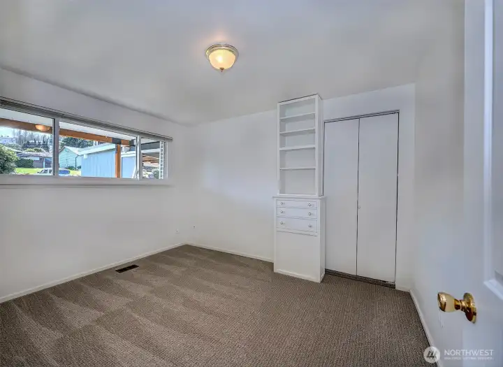 Bedroom #2 on the main floor with original built in cabinets would be a perfect spot for a home office, craft room or guest retreat.