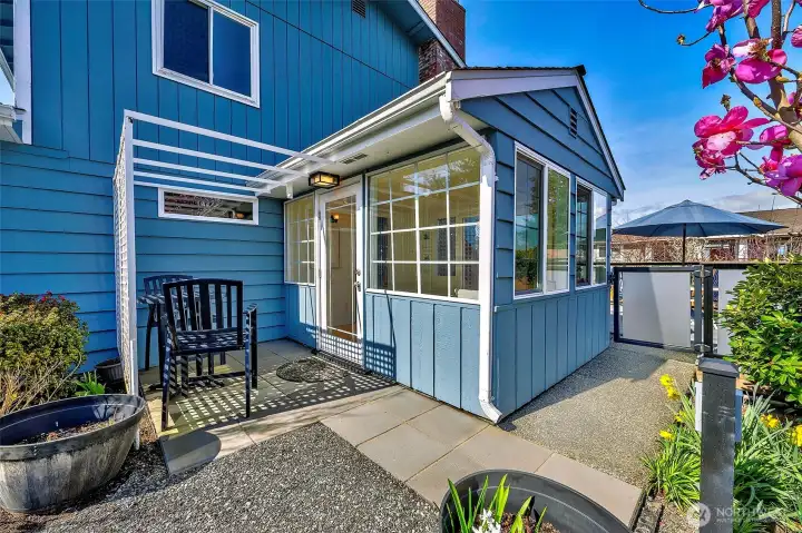 Bistro area outside of sunroom  perfect for morning coffee to catch a cool breeze on a hot day.