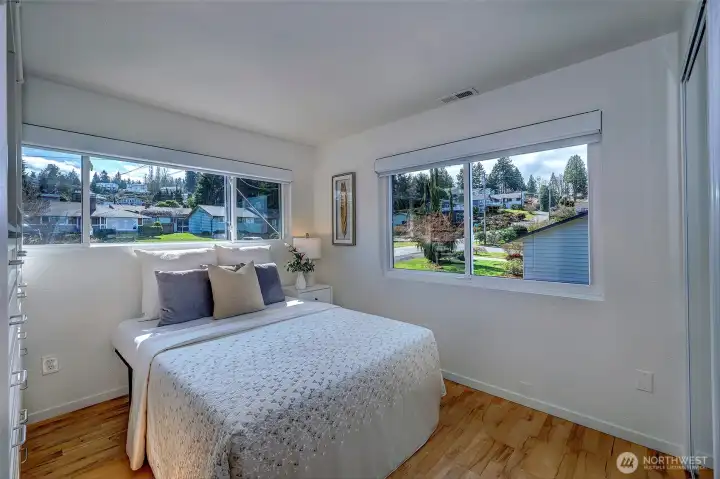 Upstairs en suite off of living room with lovely neighborhood views.