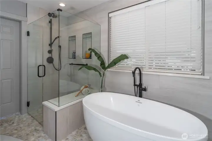 Bath is equipped with its own tankless hot water heater.