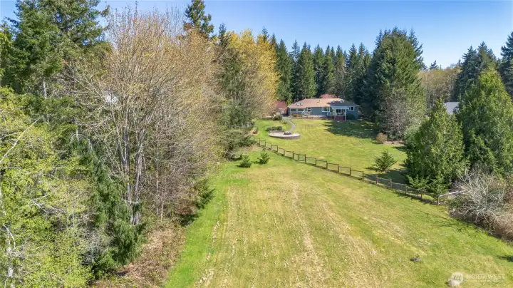 Notice the partial fenced yard for pets or people.