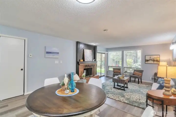 View from corner of dining and living room.  Patio door leads to patio and storage closet.