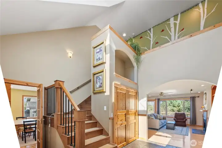 Grand vaulted entrance and stairwaywith a skylight for natural light.