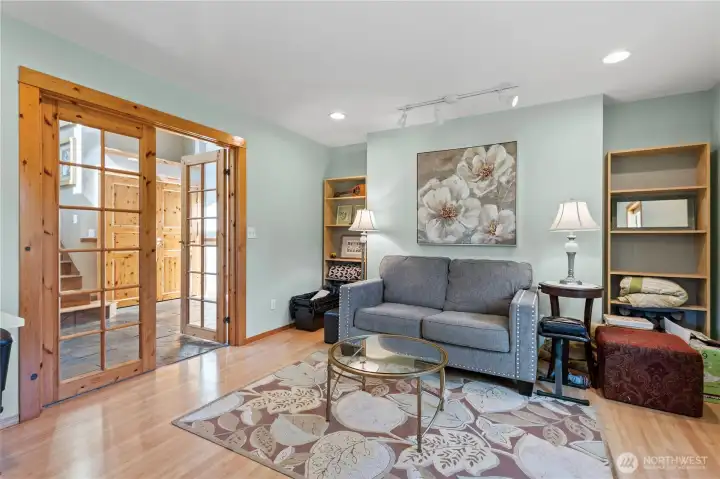 Office space with French doors to the right of entry.