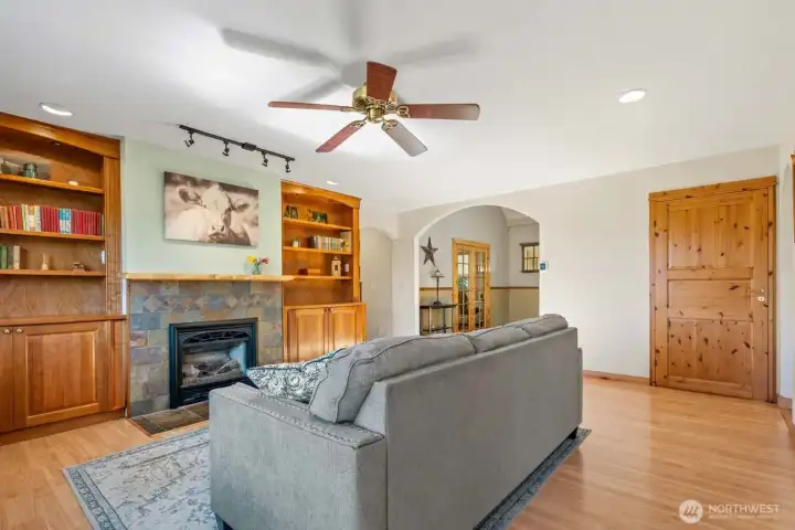 Gas fireplace insert to cozy up to. Doorway to back deck is from where this photo is taken.