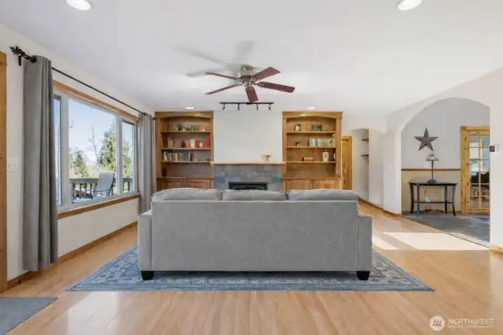 Custom made bookshelves showcase the fireplace.