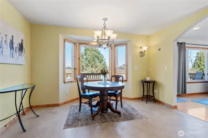 One of 3 dining options. Use as a dining space or nook. Views of Canadian range thru trees.