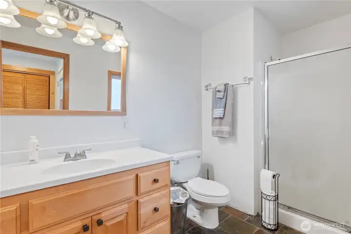 3/4 bath near kitchen and garage entrance. 1/2 bath near fireplace.